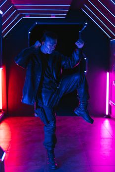 A person striking a bold pose in a neon-lit corridor, showcasing futuristic cyberpunk fashion style.. pexels, person, strikin