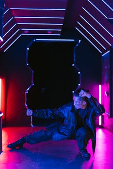 A person poses in a cyberpunk-inspired setting with vibrant neon lights.