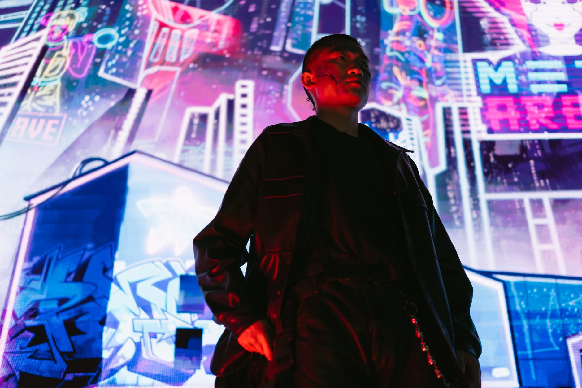 A man in a futuristic cyberpunk city with vibrant neon signs and lights.. futuristic, cyberpunk, city