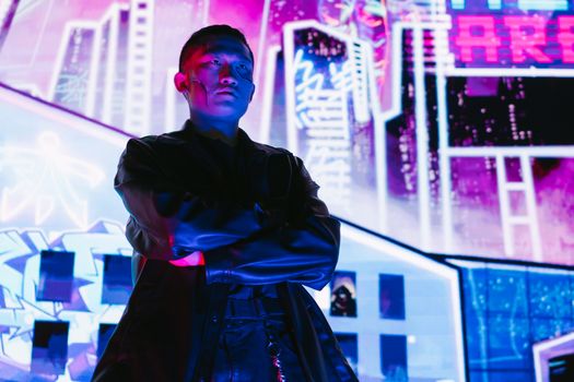 A striking portrait of a man in cyberpunk fashion, illuminated by vibrant neon lights.