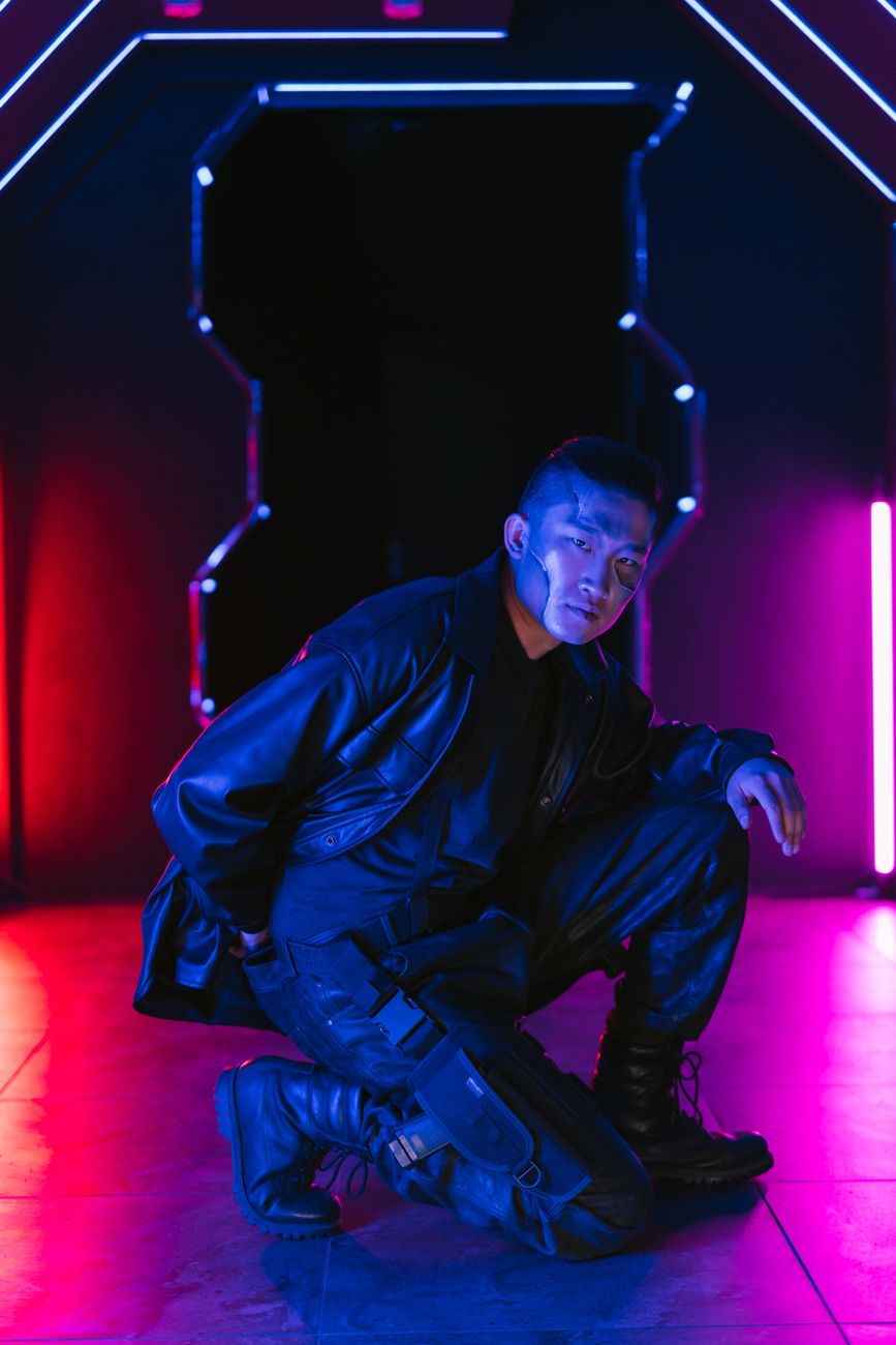 Portrait of a person in cyberpunk fashion with vibrant neon lights creating a futuristic atmosphere.