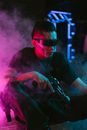 Man in Black Crew Neck T-shirt Holding a Weapon