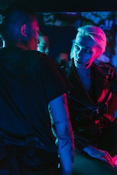 A futuristic scene featuring people in neon lights and cyberpunk fashion.