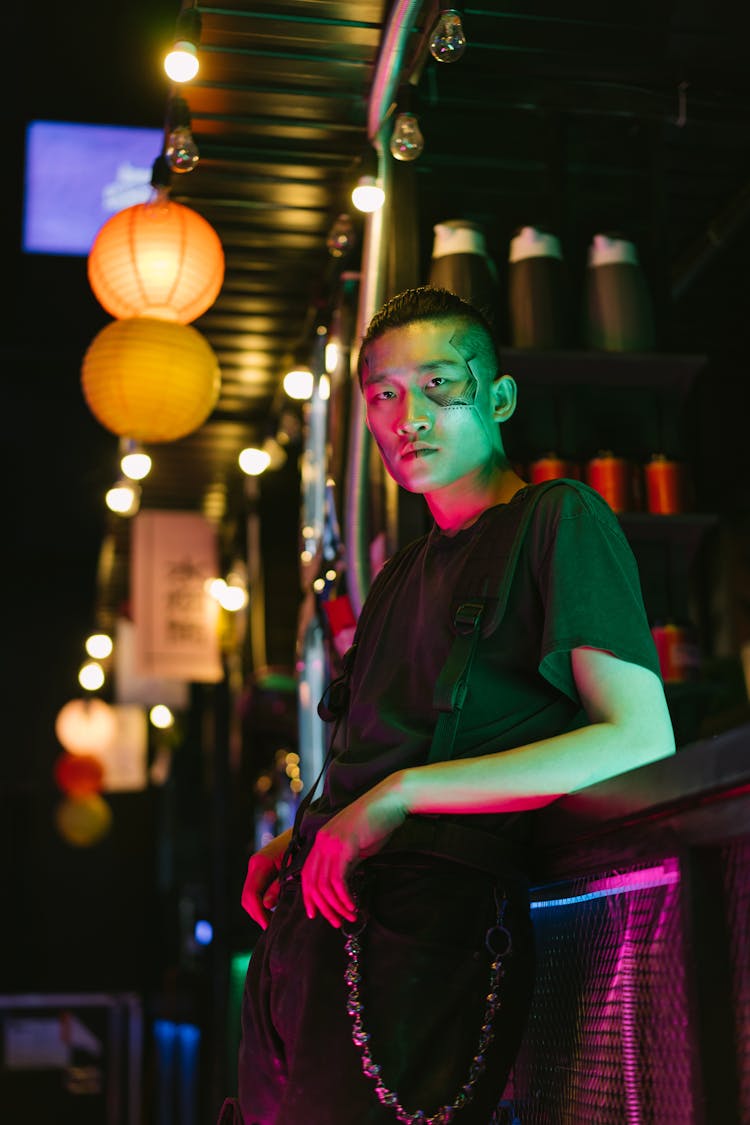 Man Leaning On A Bar