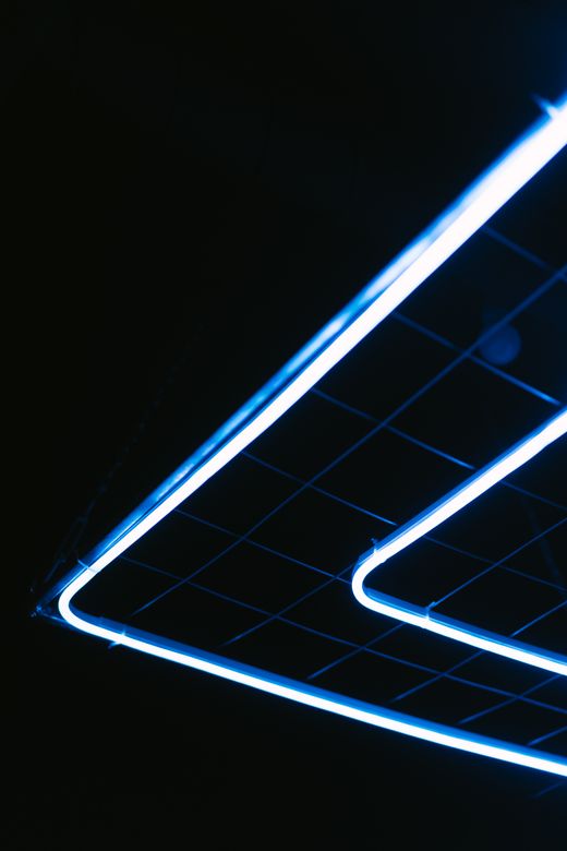 Blue neon lights in geometric patterns — Mikhail Nilov on Pexels