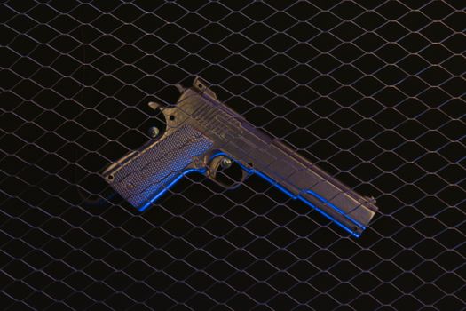 Pistol on a Black Surface 