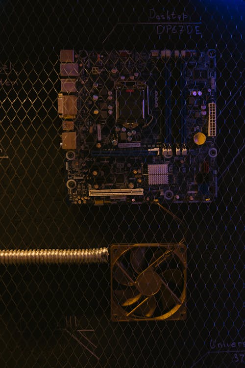 Motherboard and Fan Behind Wire Mesh