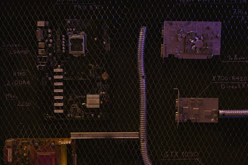 Free Circuit Board Behind a Wire Mesh Stock Photo
