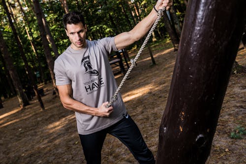 Free Photo of Man in Gray Shirt Holding Brown Rope Stock Photo