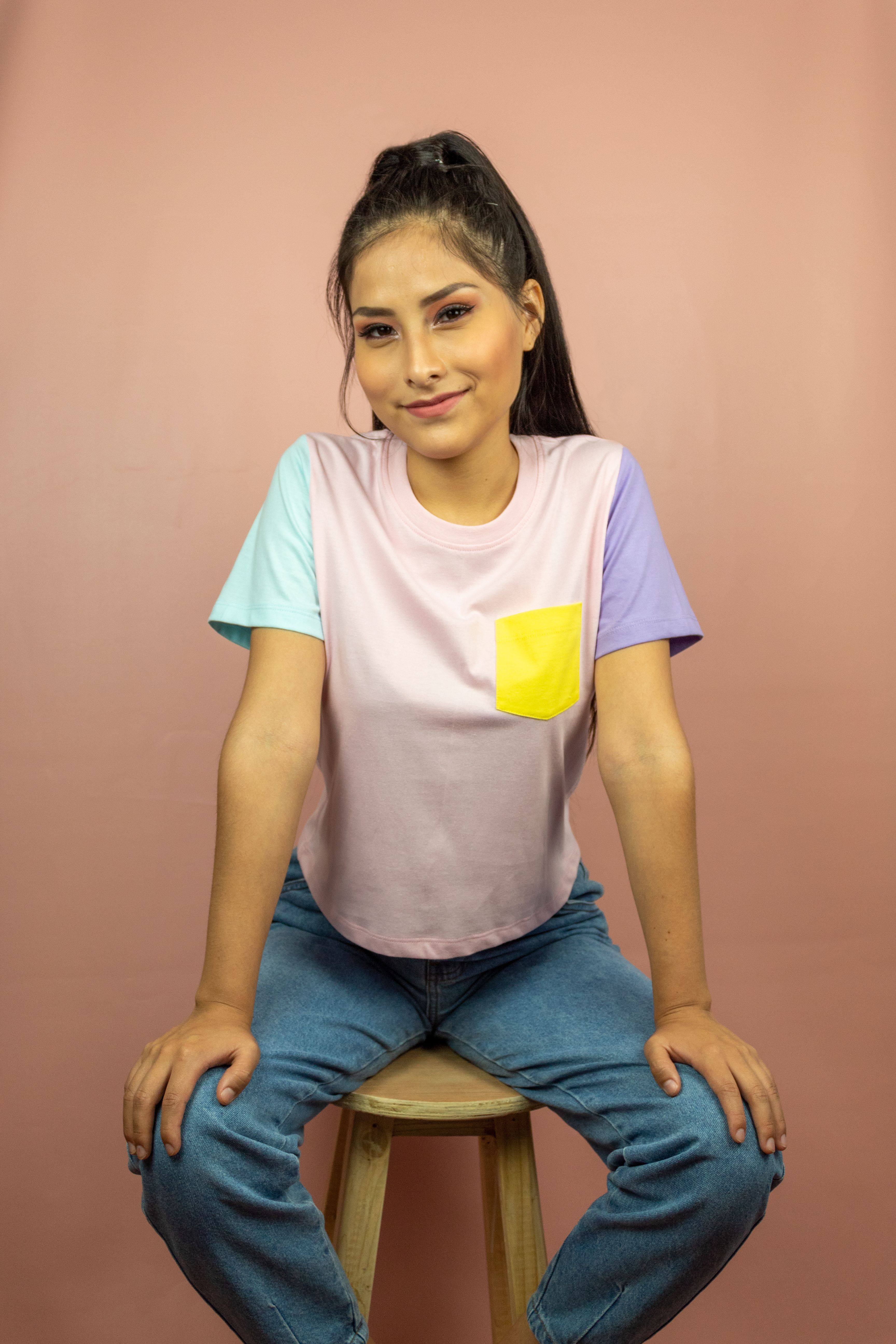 Woman in Blue Shirt Sitting on a Stool · Free Stock Photo