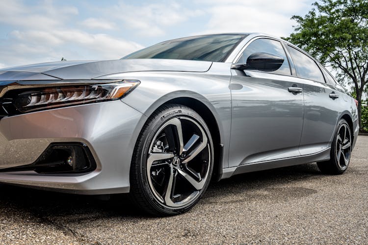 A Silver Honda Accord Parked On The Street