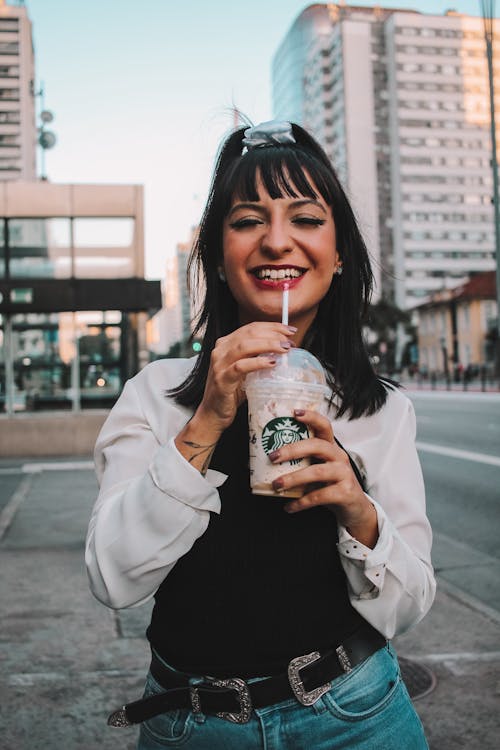 Woman Holding a Plastic Cup