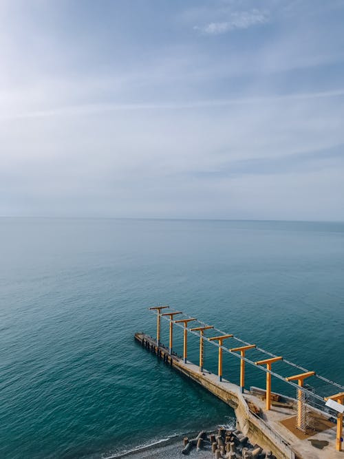High Angle Shot of a Pier on Body of Water