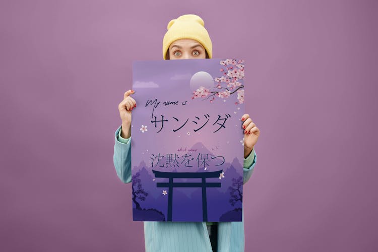 Person Holding A Purple Poster