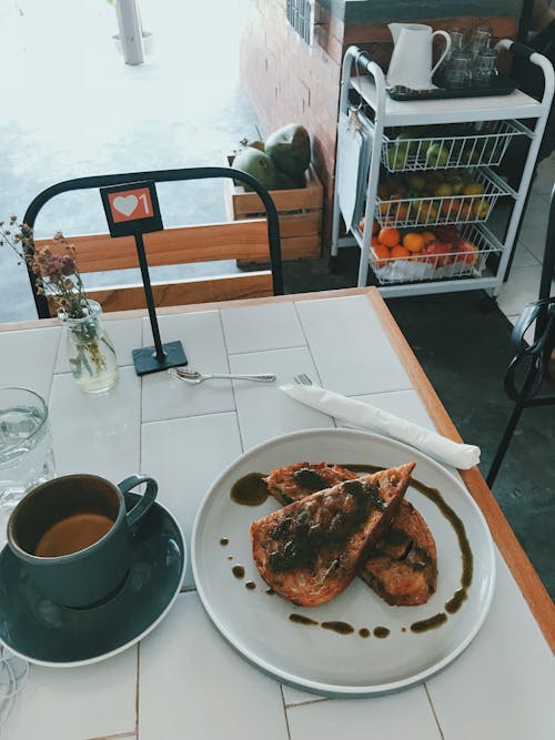 Sliced Bread with Jam on White Ceramic Plate Beside a Cup of Coffee