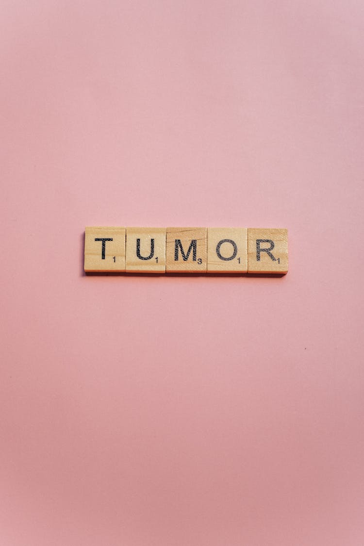 Tumor Spelled On Wooden Scrabble Pieces
