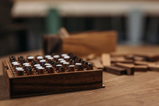 Detailed view of a wooden board game on a table, showcasing strategic play pieces.