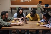 Group of People Sitting at the Table