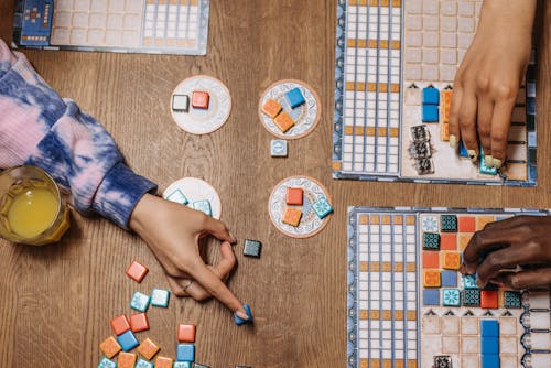 Free Hands Playing Board Games Stock Photo