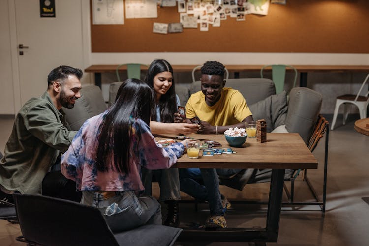 Group Of Friend Playing Card Games