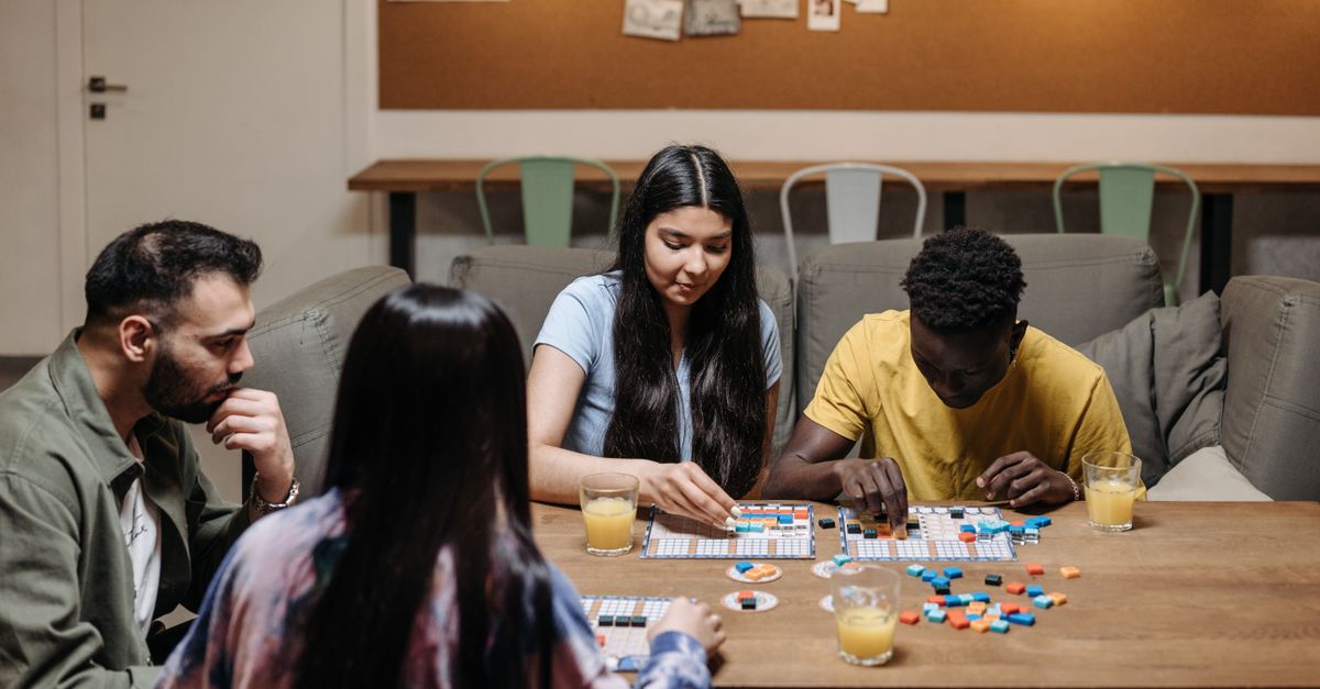 cozy community center with people playing board games