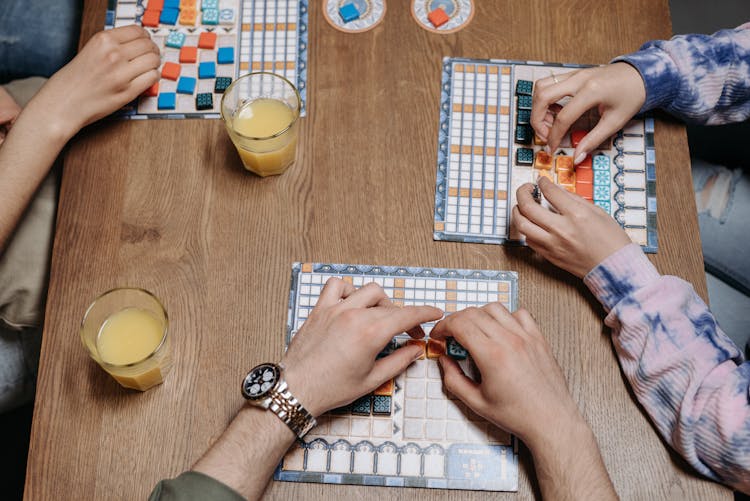 People Playing An Azul Board Game