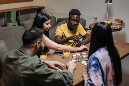 Free Friends Playing Card Games Stock Photo