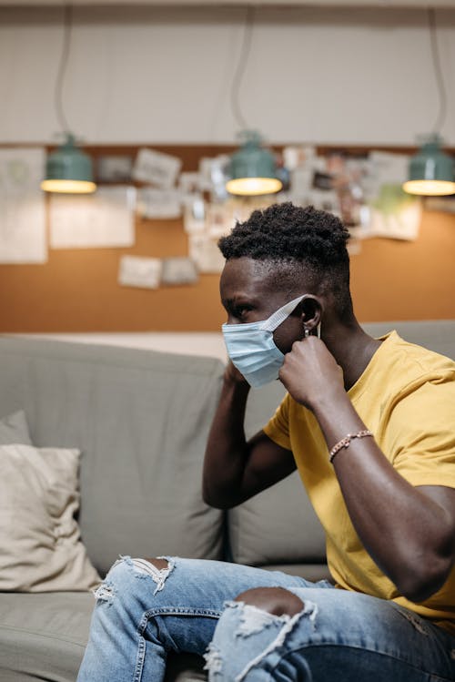 Man Sitting in Mask