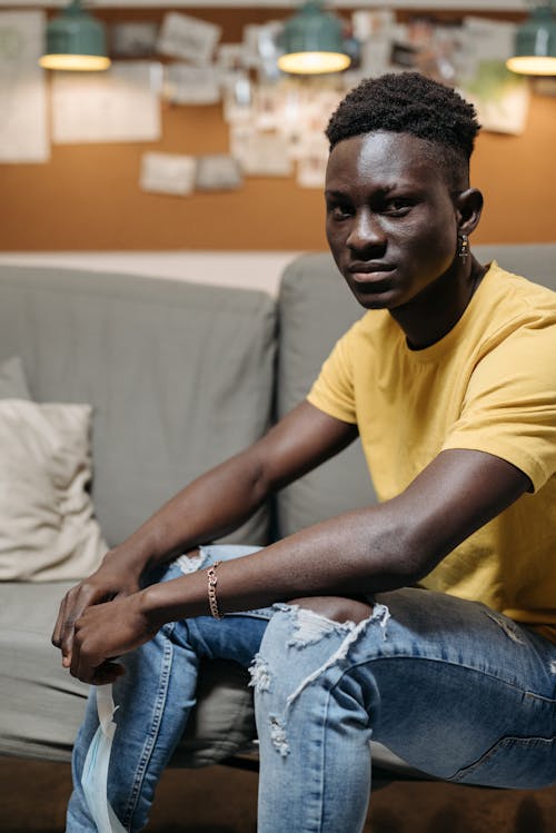 Man Sitting on Couch