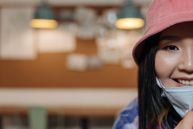 Woman Wearing A Pink Bucket Hat Smiling