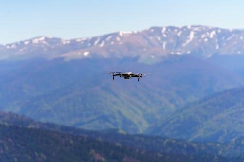 A Drone Flying Near the Mountain