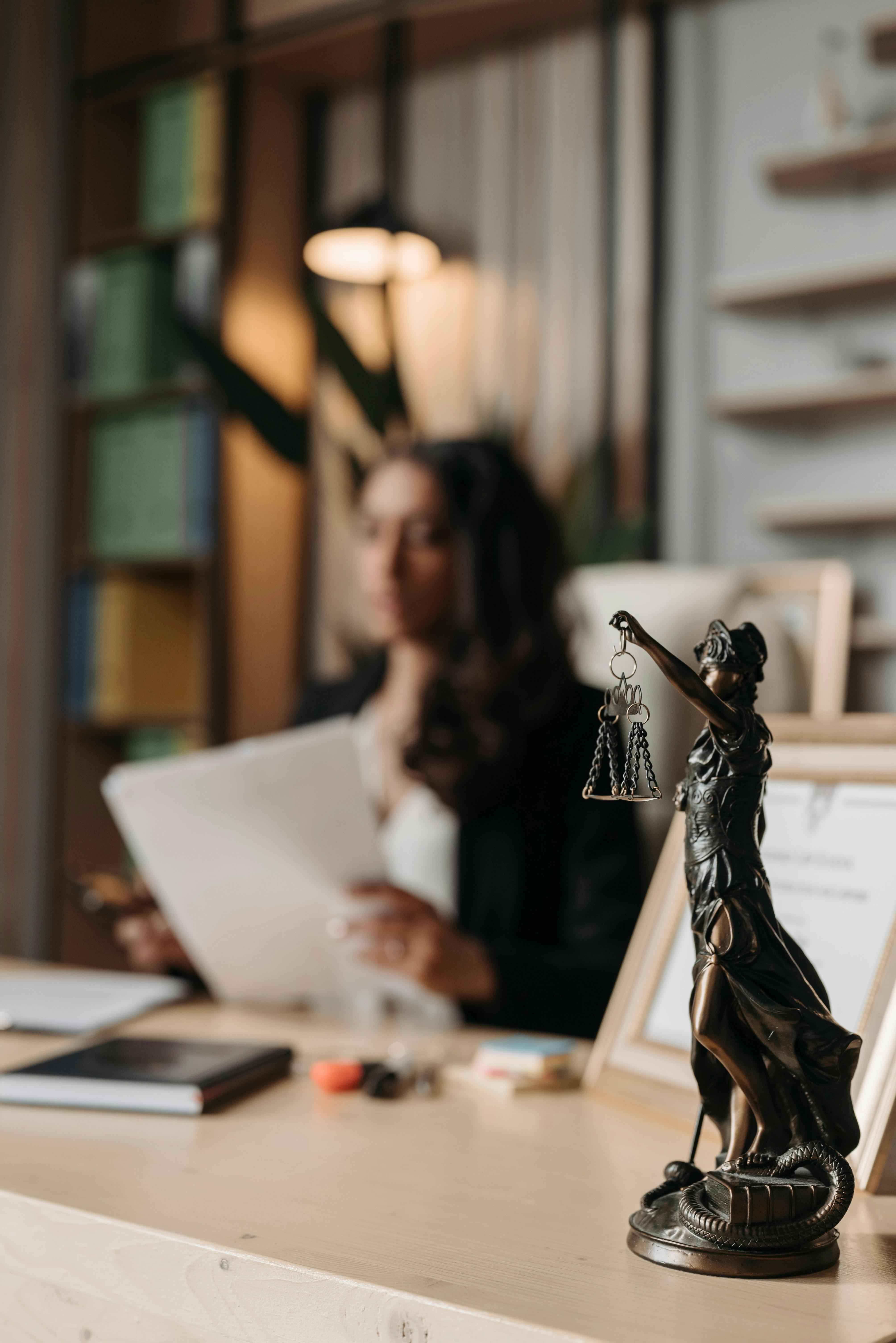 figurine of justice on table in office