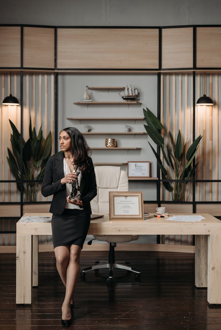 Woman Sitting On Wooden Table