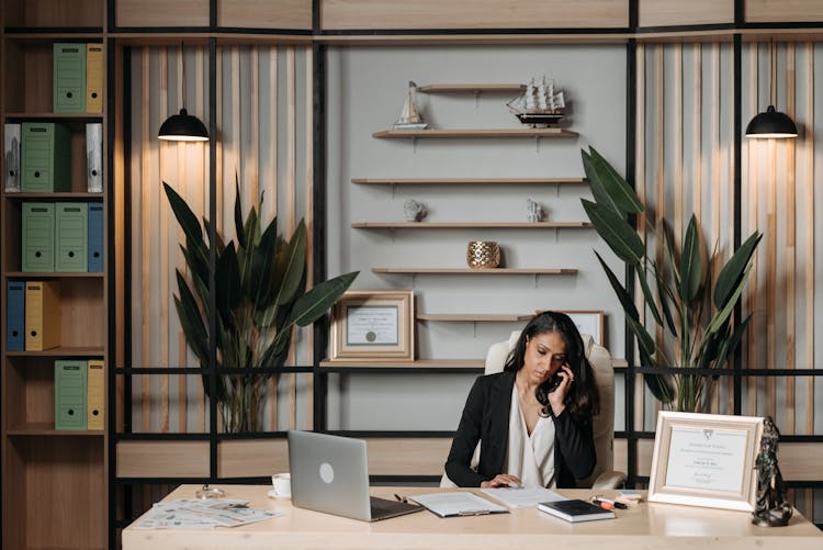 Woman Working At The Desk In Office