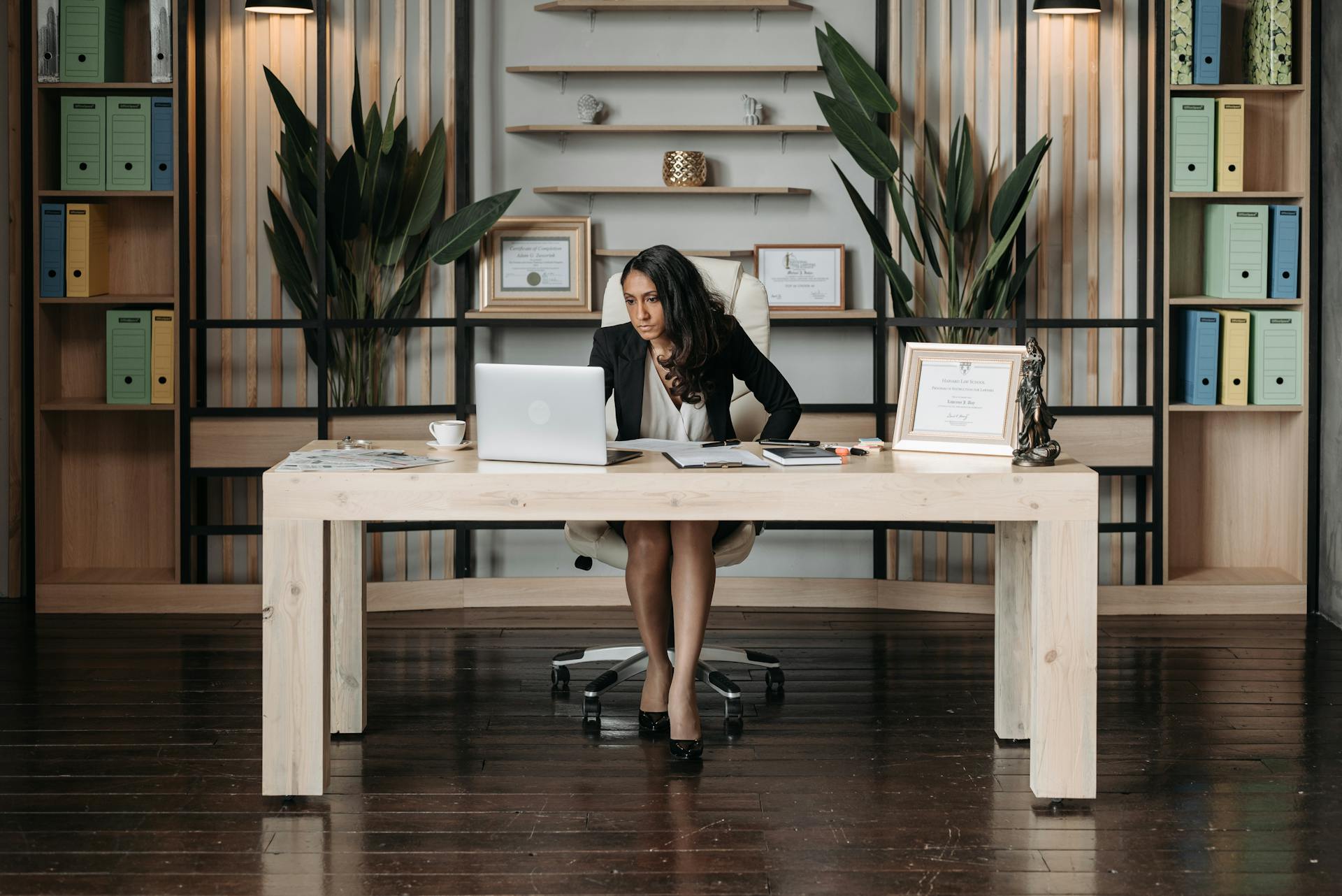 Woman in Black Blazer Working in the Office