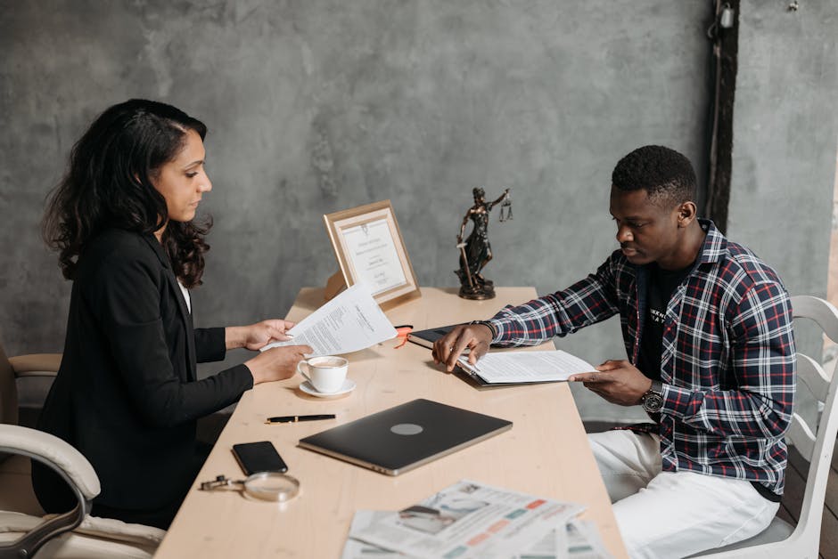 A lawyer consulting with a client - best slip and fall lawyer near me