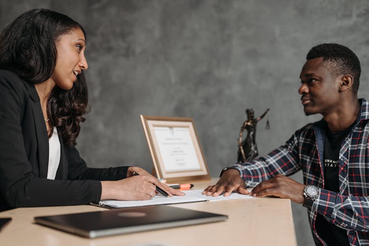 Female Lawyer And A Client Having A Discussion 