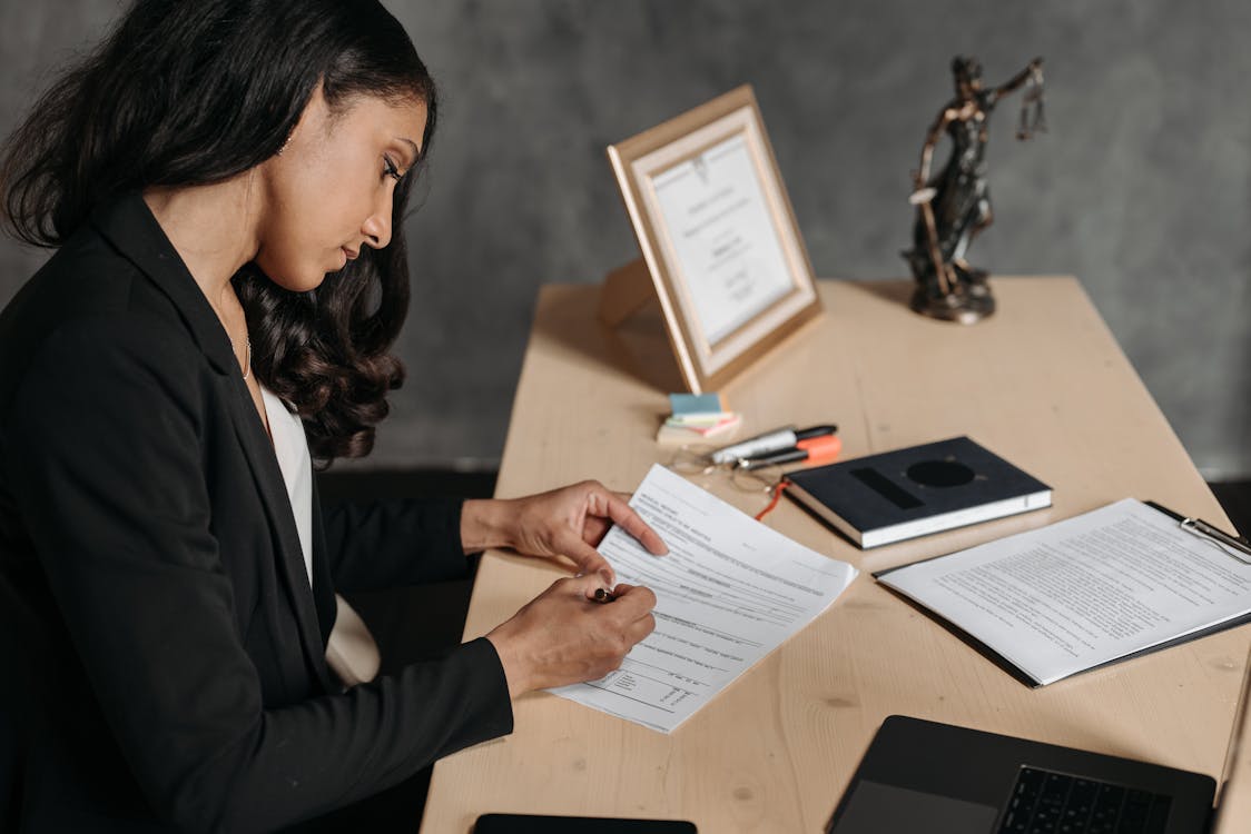 Free Female Lawyer looking at Documents Stock Photo