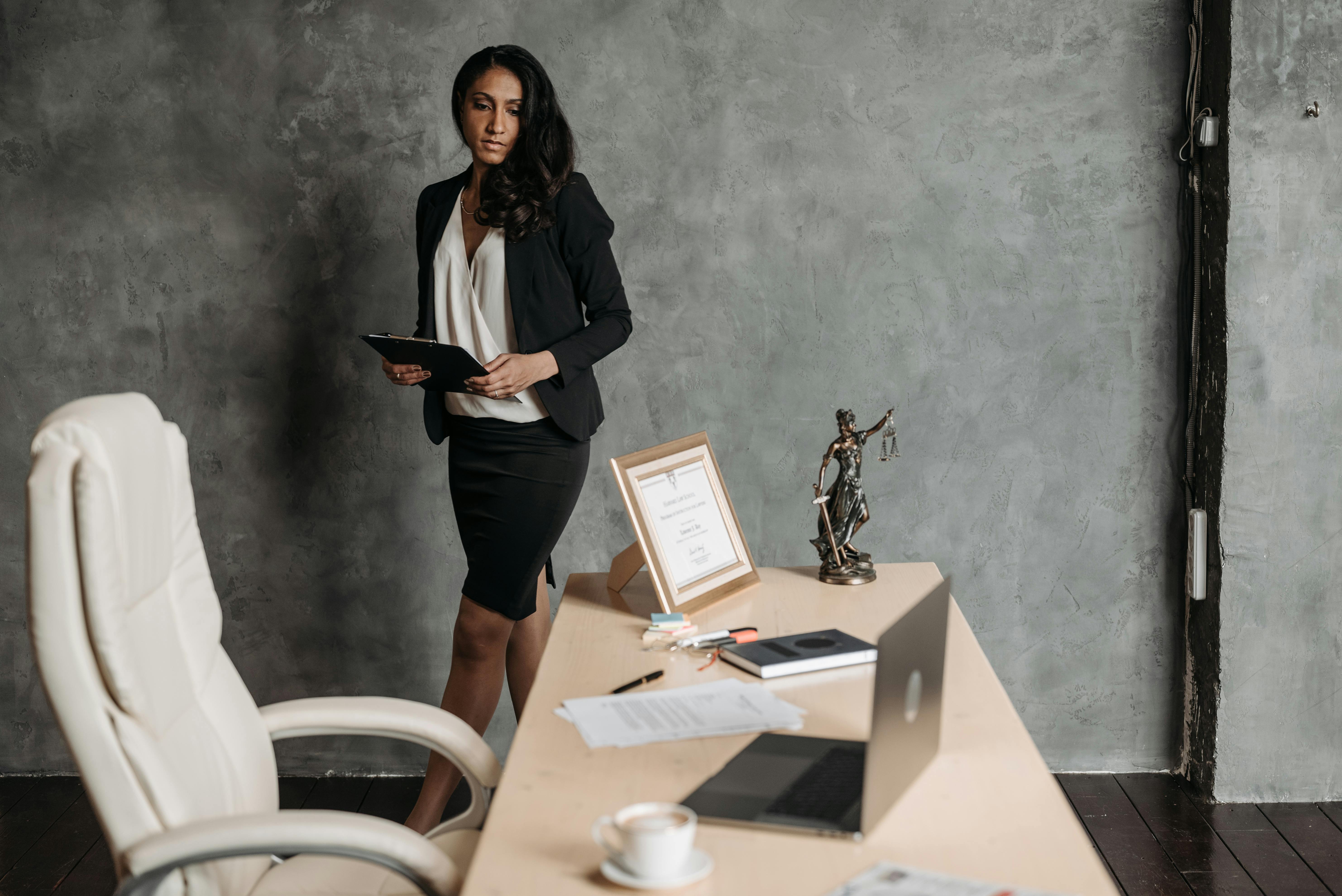 woman standing near desk in office