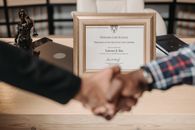Person Holding Brown Wooden Frame