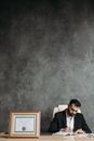 Man in Black Shirt Sitting on Chair