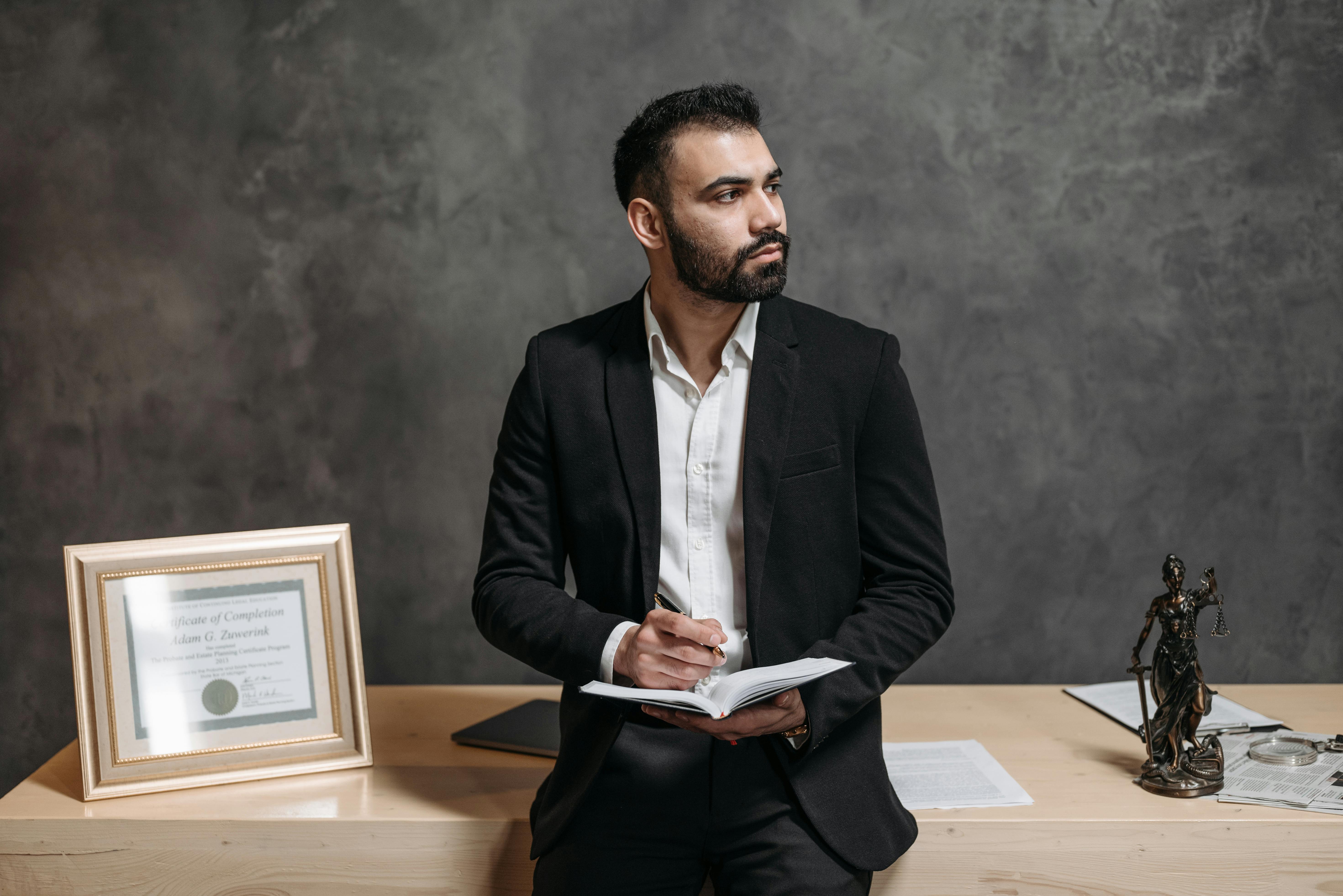 professional male lawyer holding a notebook