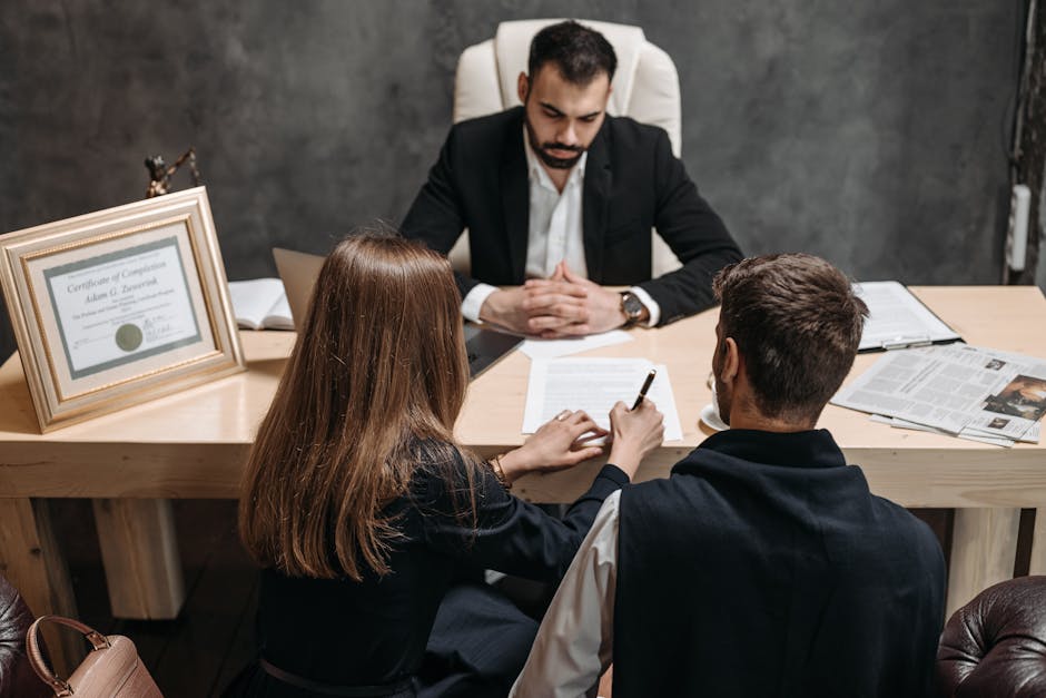 A lawyer and client reviewing documents in an office setting - motorcycle accident fort lauderdale A lawyer and client reviewing documents in an office setting - motorcycle accident fort lauderdale
