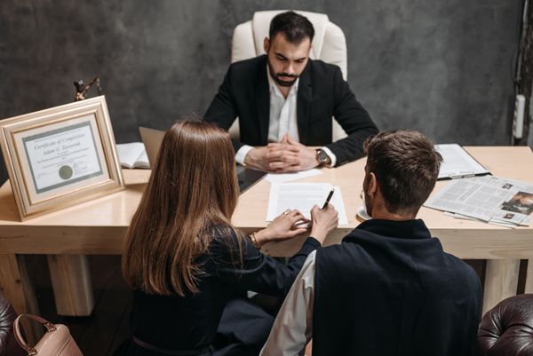 A professional reviewing insurance documents with a client.