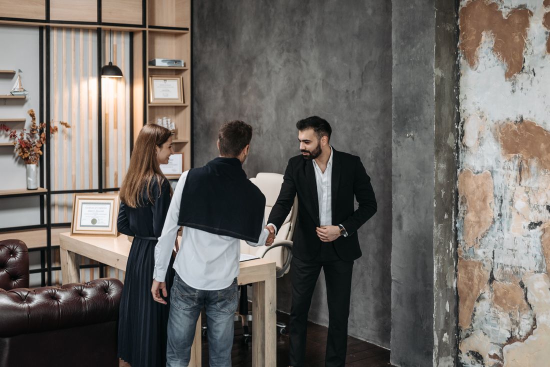 Immigration consultant discussing visa options with clients in a modern office