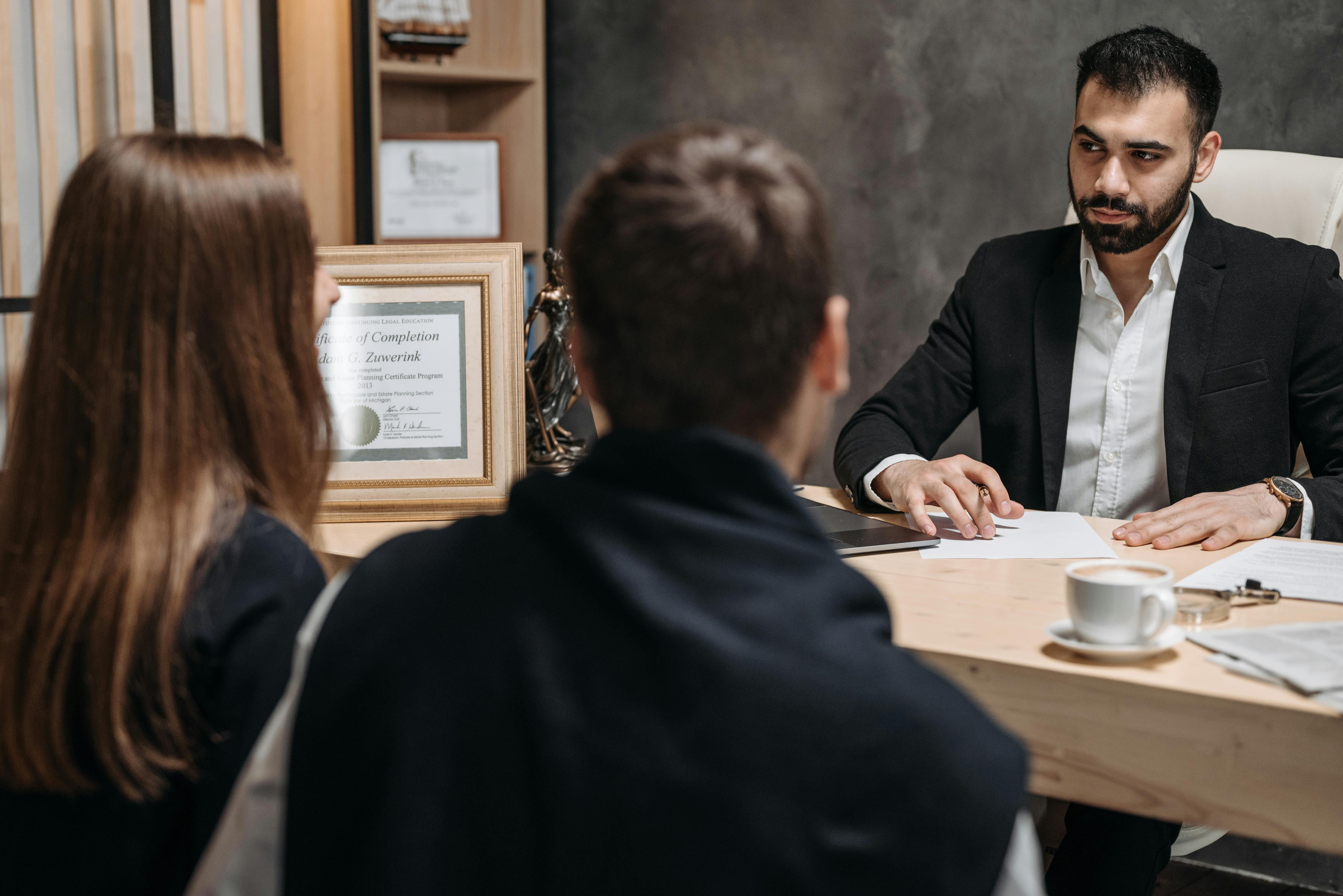 clients and lawyer in an office