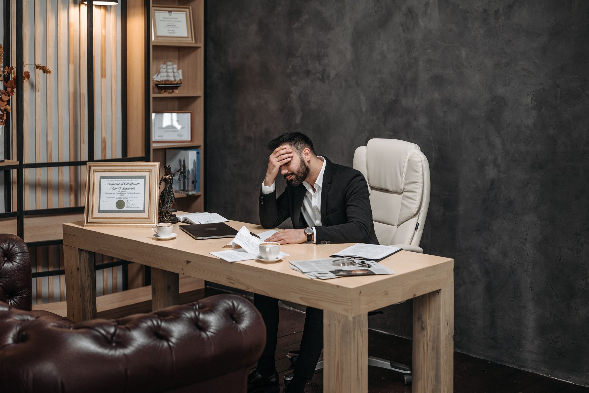 Trader reviewing charts at desk — studying what happened to the trade that reversed at entry