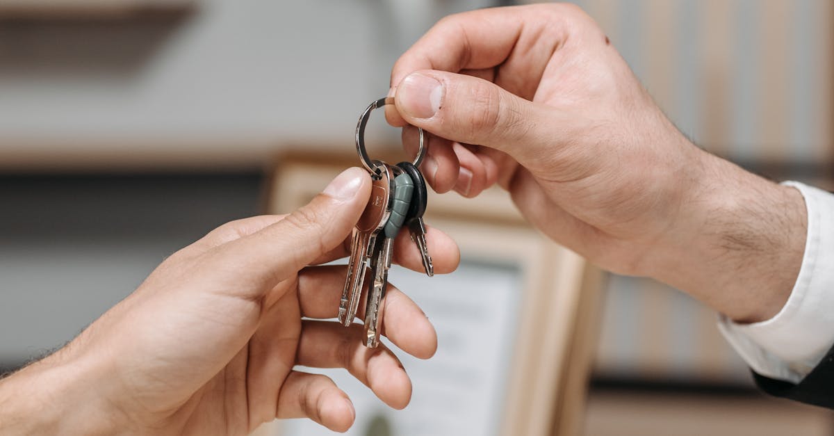A Person Giving Keys to Another Person · Free Stock Photo
