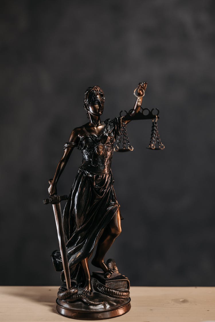 Close-up Photo Of A Lady Justice Statuette 