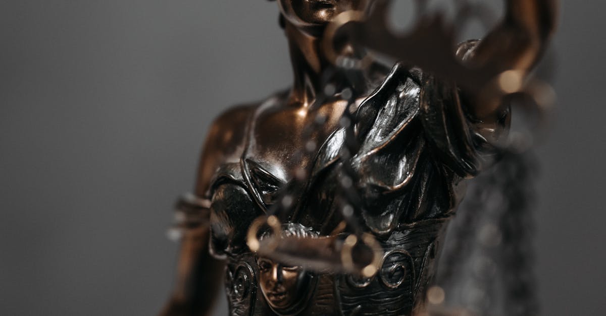 Photo by Pavel Danilyuk Detailed bronze statue of Lady Justice with scales, symbolizing law and justice.